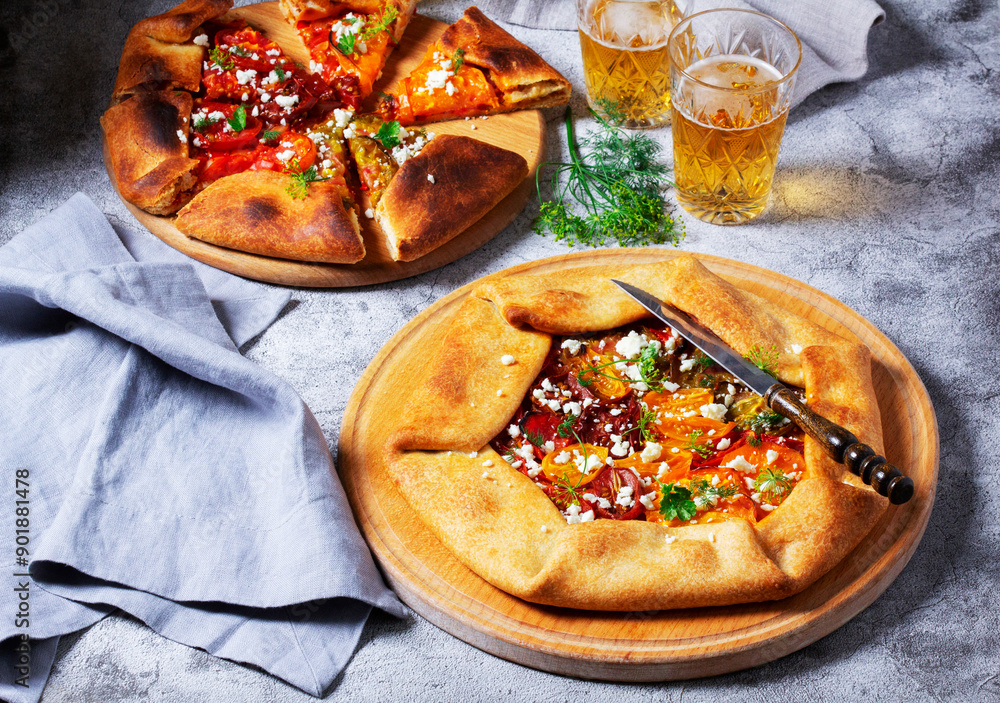 Traditional open pie galette with tomatoes, cheese and herbs, served with beer or wine.