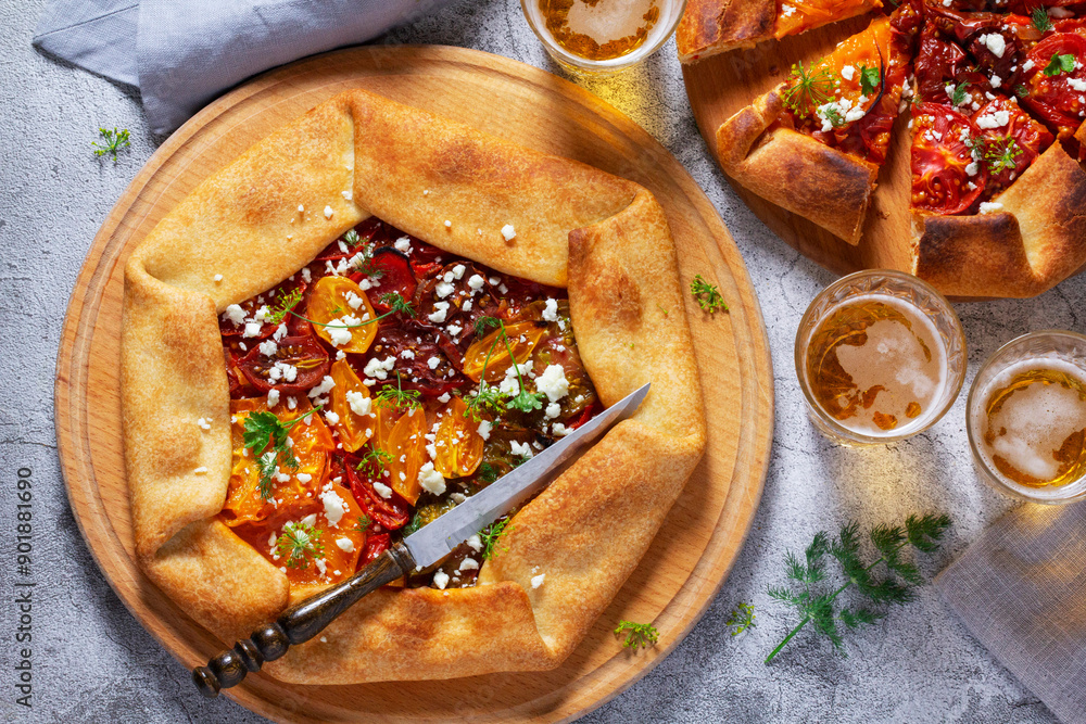 Traditional open pie galette with tomatoes, cheese and herbs, served with beer or wine.