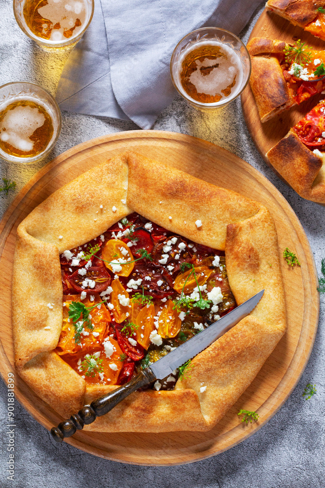 Traditional open pie galette with tomatoes, cheese and herbs, served with beer or wine.