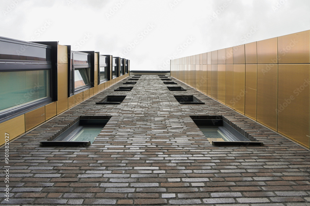 Low angle view of a apartment building against the sky Low angle view of a apartment building against the sky