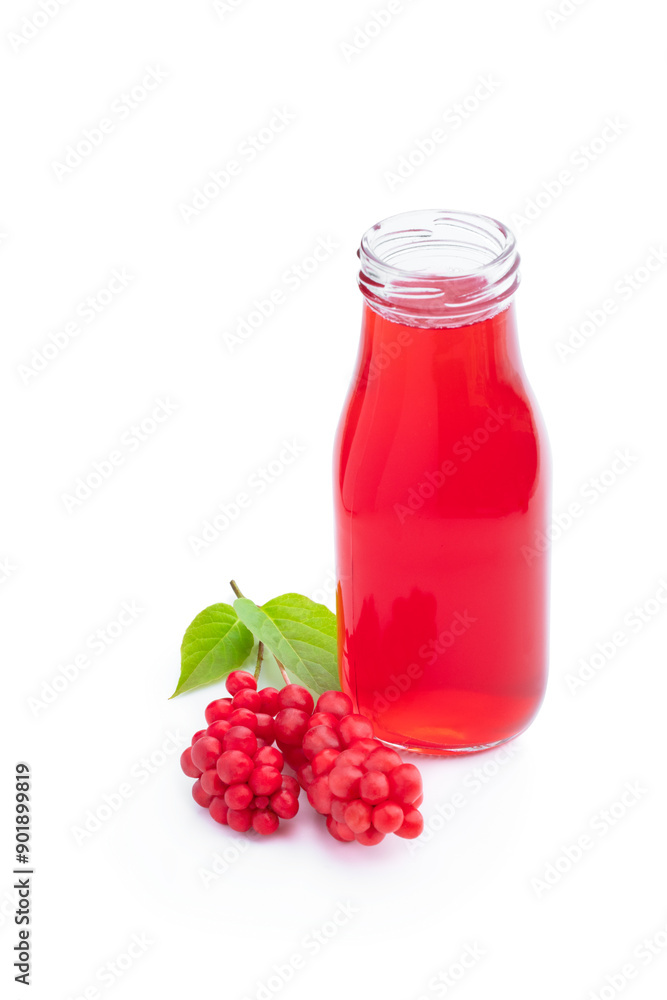 Schisandra berry juice in glass bottles isolated on white Schisandra berry juice in glass bottles isolated on white