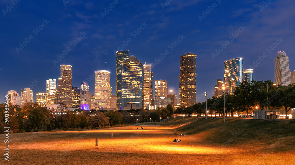 Houston City skyline illuminated at night in Houston, Texas, USA.