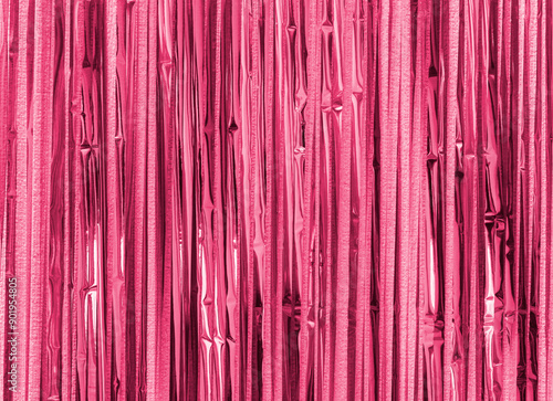 Pink purple foil strip background. Curtain hanging on wall. Festive, Christmas, New Year or anniversary party concept. Decorative wallpaper