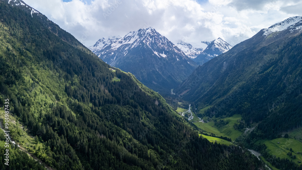 Breathtaking Aerial Landscape View of Snow-Capped Mountains and Lush Valleys During Daylight in the Alps Breathtaking Aerial Landscape View of Snow-Capped Mountains and Lush Valleys During Daylight in the Alps