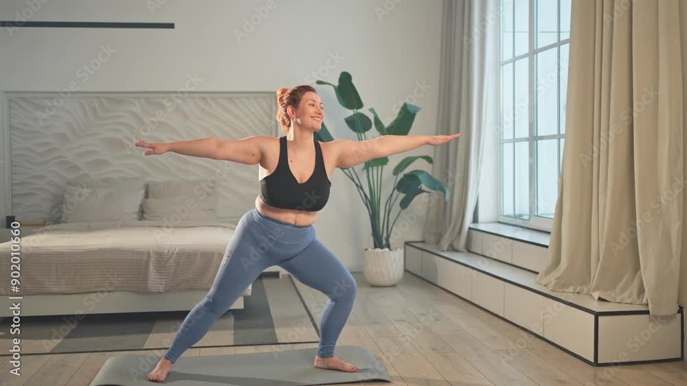 Yoga fitness workout training. Woman practicing yoga at home. Plus size female doing sports exercise on yoga mat indoor. Girl in sportswear have training workout for weight loss. Sport and fitness Yoga fitness workout training. Woman practicing yoga at home. Plus size female doing sports exercise on yoga mat indoor. Girl in sportswear have training workout for weight loss. Sport and fitness