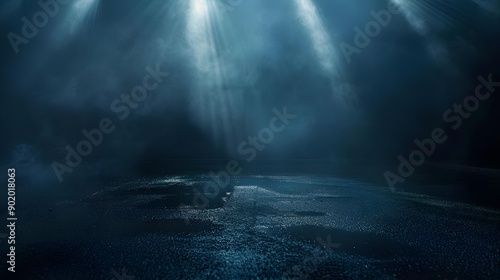 Urban scene of dark street with wet asphalt and reflections of rays