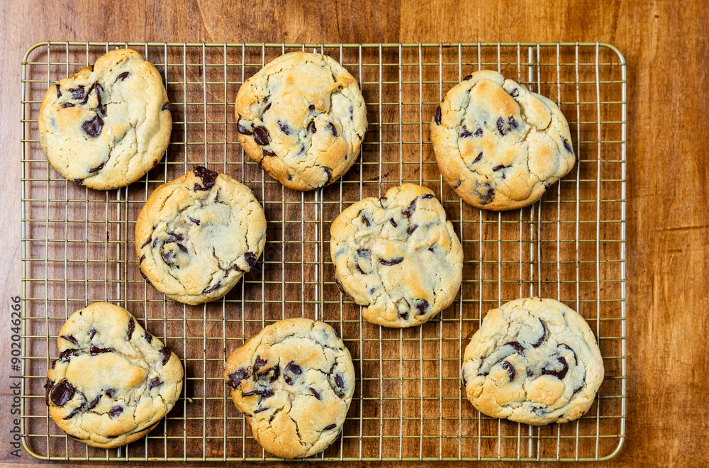 Fresh baked Chocolate Chip Cookies on cooling rack, flat lay, background. Fresh baked Chocolate Chip Cookies on cooling rack, flat lay, background.