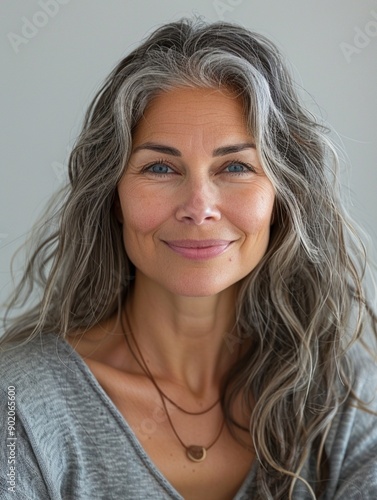 woman, lite smile front portrait magic lite, lite gray white gradient background, studio, gray hair