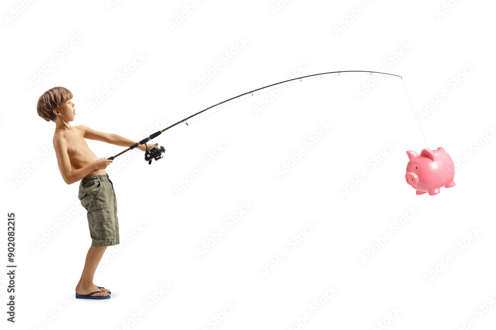Obraz premium Boy fishing and catching a piggy bank with a fishing rod