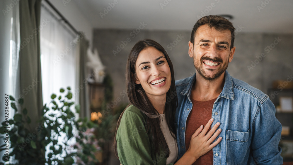 Portrait of beautiful couple stand, smile and hug at home Portrait of beautiful couple stand, smile and hug at home