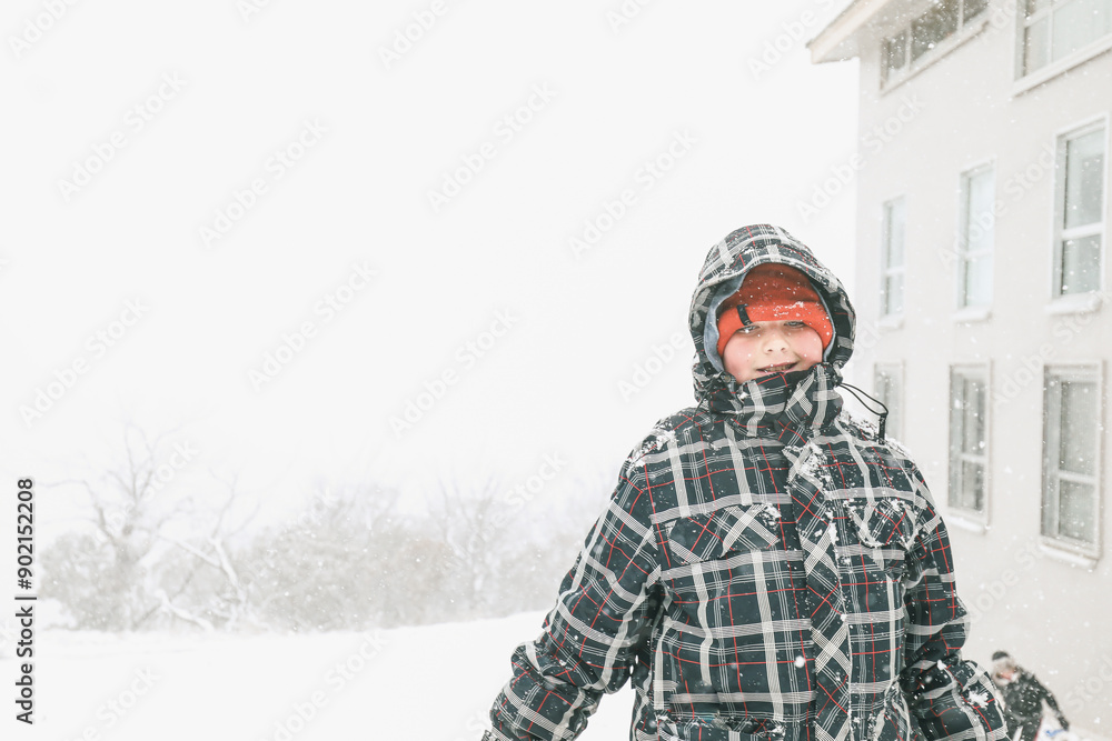 Boy standing in the snow on foggy day at Mount Buller Boy standing in the snow on foggy day at Mount Buller