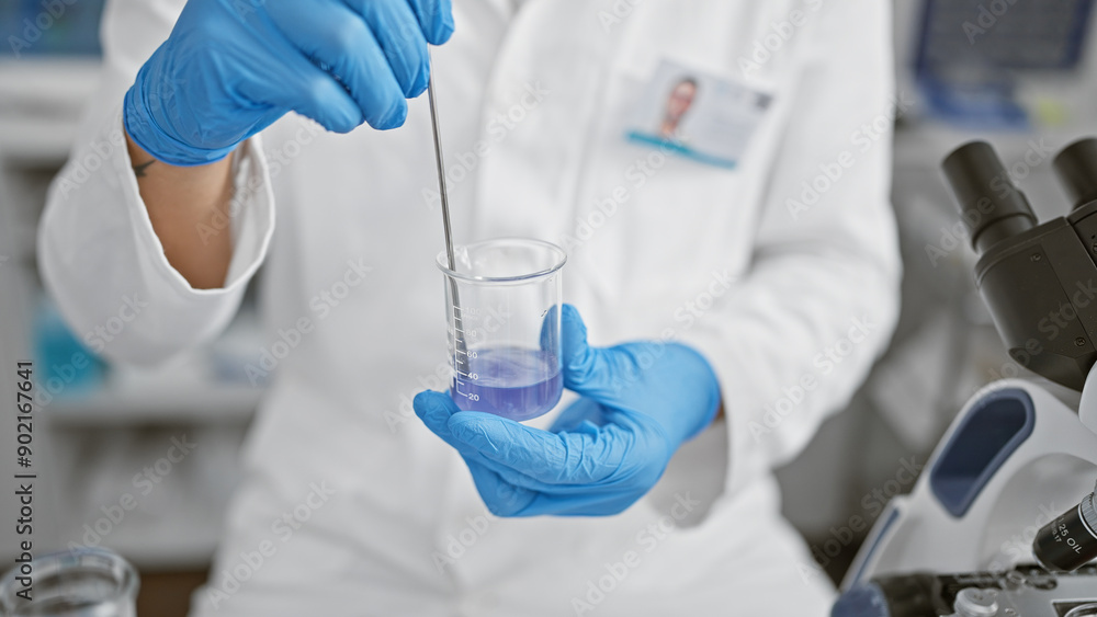 A scientist pours liquid into a beaker against a backdrop of microscopes and lab equipment, illustrating research and healthcare. A scientist pours liquid into a beaker against a backdrop of microscopes and lab equipment, illustrating research and healthcare.