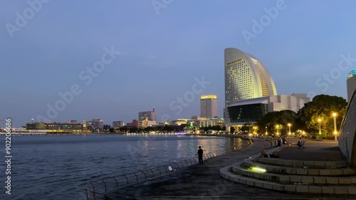 Twilight view of Yokohama waterfront with modern buildings and calm waters photo