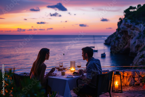 Romantic dinner by the sea at sunset photo