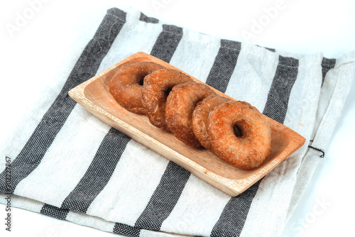 Kue Cincin often called Donut Cake, or Ali Agrem is a cake that is served as a daily snack. It is made from brown sugar mixed with rice flour, on wooden plate photo