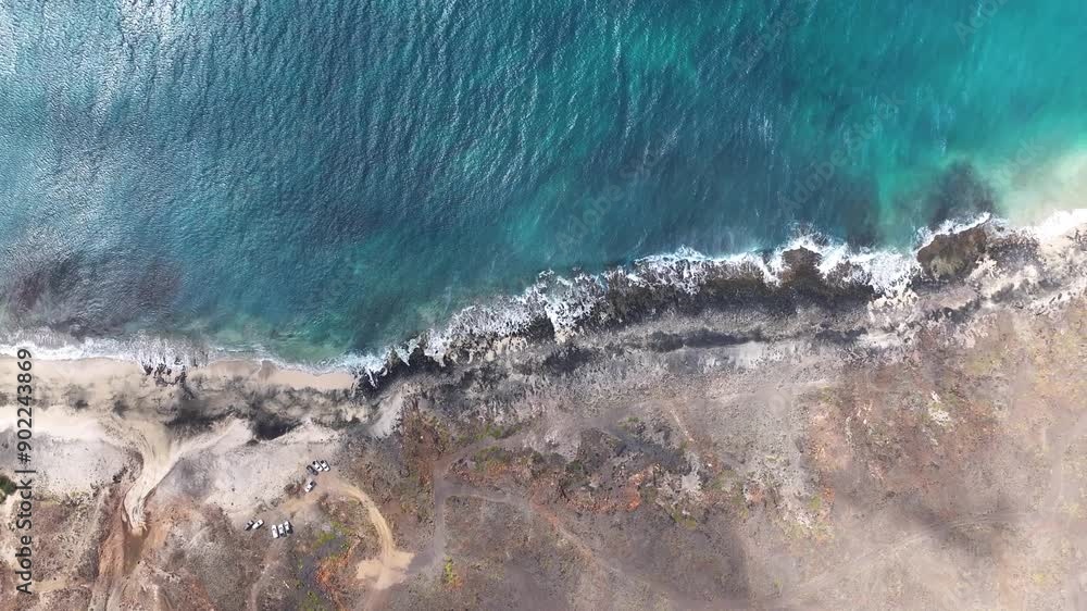 Top Down Aerial View, Deserted Beach on Volcanic Island and Ocean Waves, High Angle Drone Shot 60fps Top Down Aerial View, Deserted Beach on Volcanic Island and Ocean Waves, High Angle Drone Shot 60fps