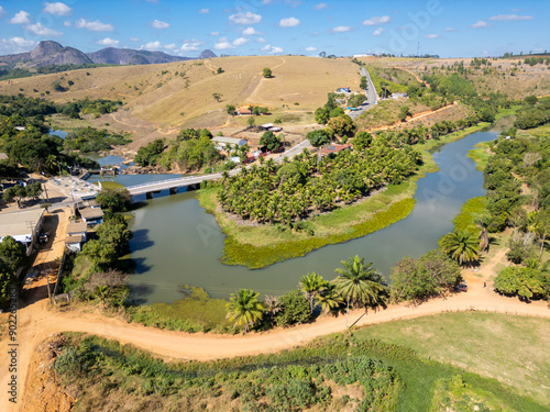 Aerial Drone view of the bridge over Sao Jose river and the small hydroelectric dam in Sao Gabriel da Palha, ES, Brazil photo