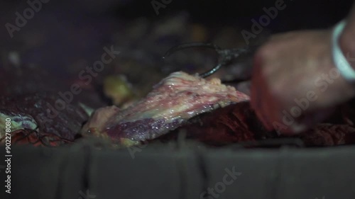 Wallpaper Mural Hands flipping a juicy beef cut over glowing embers at an Argentine asado - slow motion Torontodigital.ca