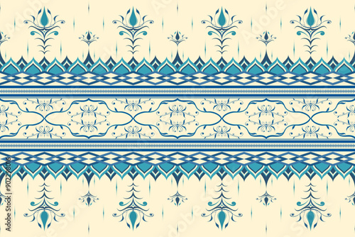 An elegant traditional floral pattern featuring intricate blue and turquoise designs on a beige background. Perfect for use in textiles, wallpapers, and decorative projects