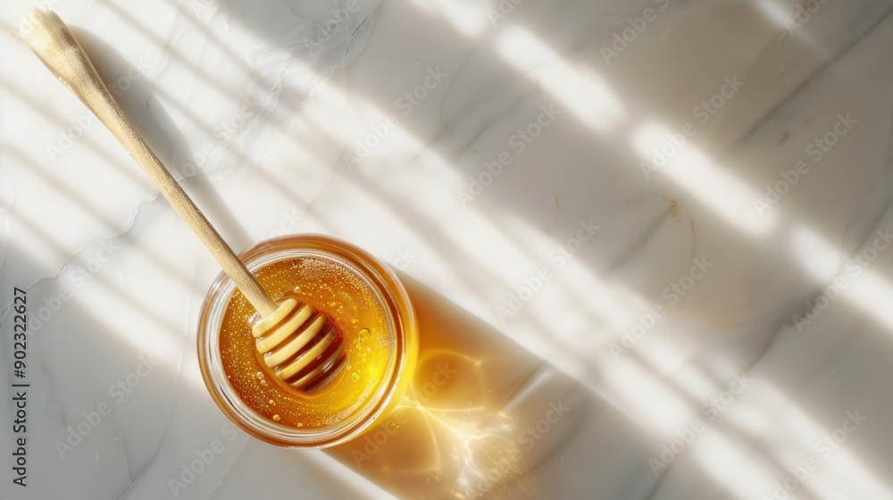 jar of honey on white table jar of honey on white table