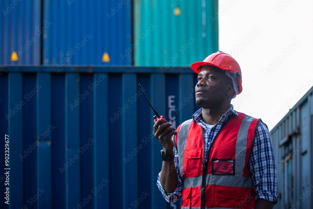 Man american african with talkie walkie at worker industry dock or container yard. foreman talking radio working control loading cargo shipping transport. Man american african with talkie walkie at worker industry dock or container yard. foreman talking radio working control loading cargo shipping transport.