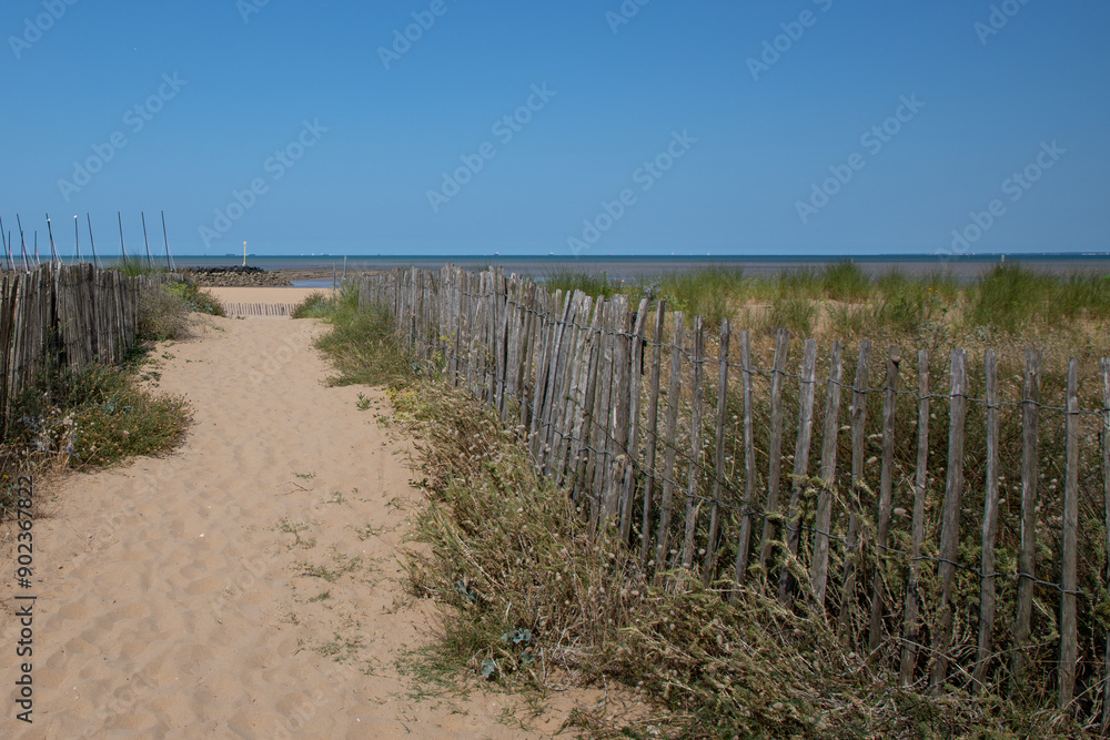 Beach pathway access on sand fence access sea in ocean atlantic in France Beach pathway access on sand fence access sea in ocean atlantic in France