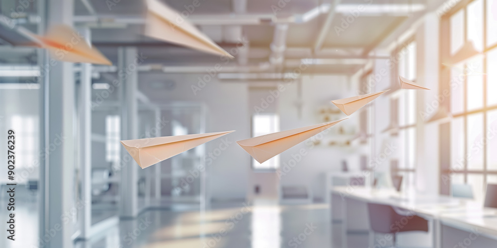 Obraz premium Innovative Business Idea: Paper Airplanes Soaring in Contemporary Office Environment Ideal for Commercial Advertising and Promotional Use