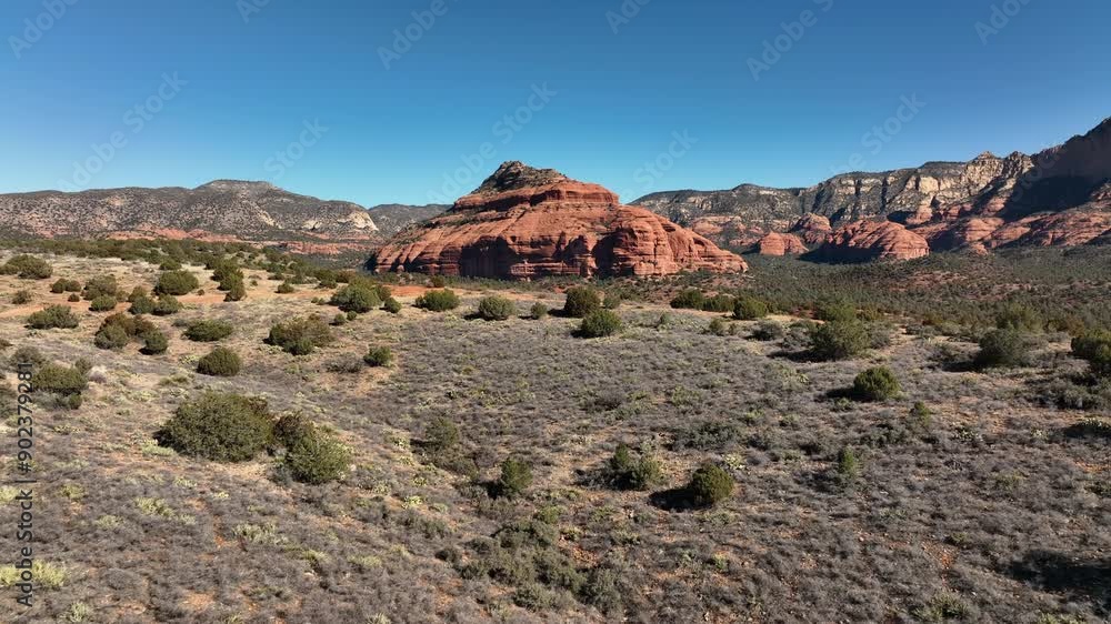 Backwards Tracking Of Red Rock Mountains and Green Desert Foilage In Sedona, Arizona, Aerial View Backwards Tracking Of Red Rock Mountains and Green Desert Foilage In Sedona, Arizona, Aerial View