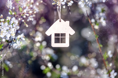 Wallpaper Mural symbol of the house among the white cherry blossoms
 Torontodigital.ca