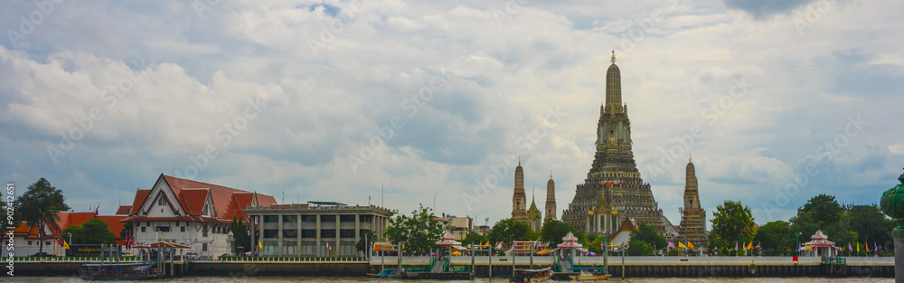 Naklejka premium asia travel concept with old architecture and old pagoda (wat arun) with boat at thailand temple