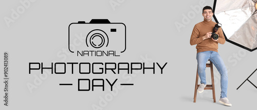 Young male photographer wit...