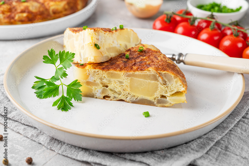 Spanish omelette tortilla with potatoes and onion on a stone background. Spanish cuisine. Top view. Spanish omelette tortilla with potatoes and onion on a stone background. Spanish cuisine. Top view.