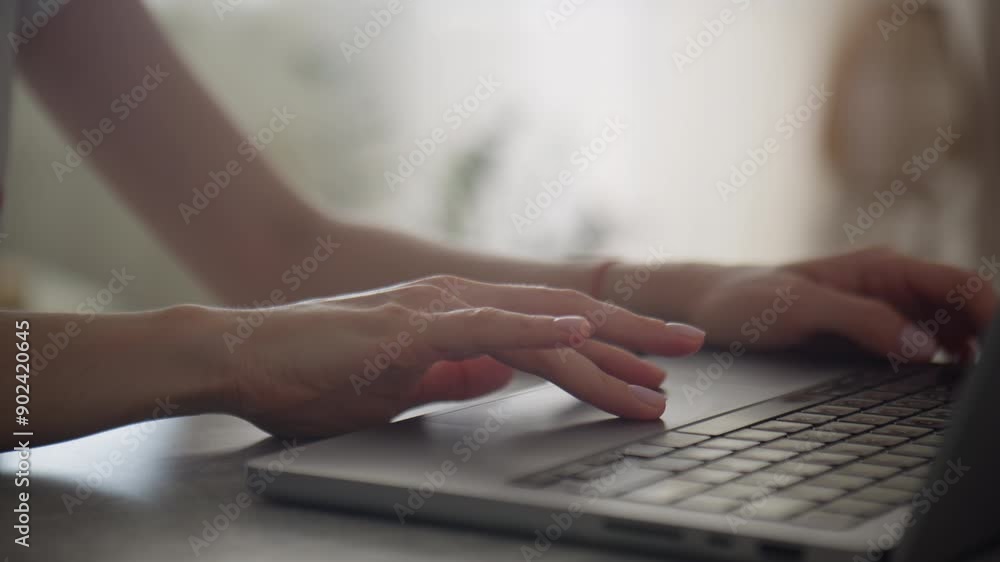 Close-Up of Hands Browsing on Laptop Touchpad in Bright Room Close-Up of Hands Browsing on Laptop Touchpad in Bright Room