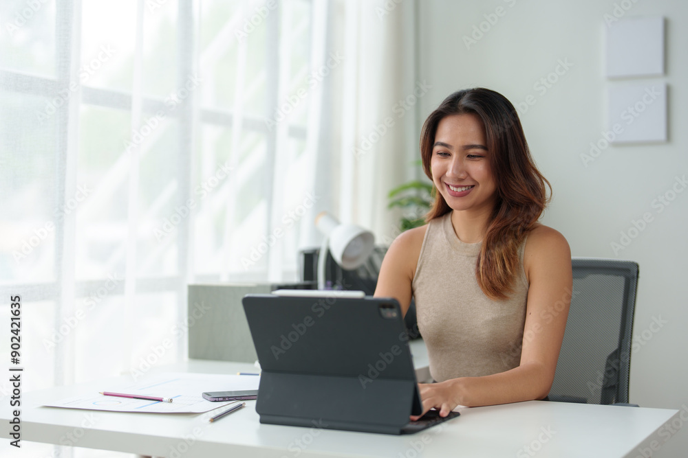 Asian businesswoman or executive manager using laptop computer is checking data, typing, searching, financial records, statistics, taxes, income in online business in office. Asian businesswoman or executive manager using laptop computer is checking data, typing, searching, financial records, statistics, taxes, income in online business in office.