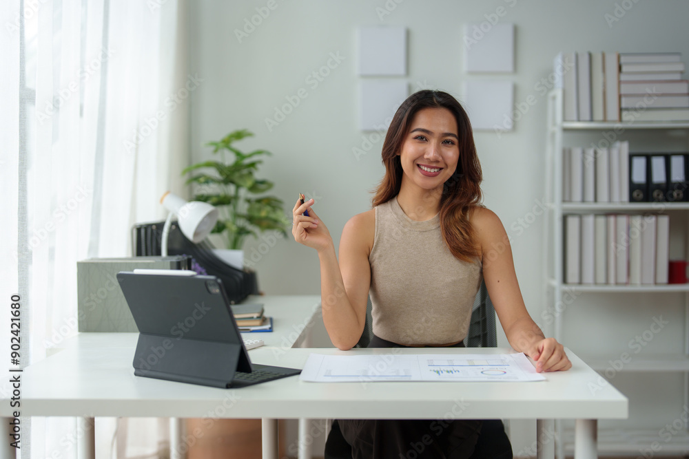 Asian businesswoman takes notes in an online meeting on the internet using her laptop. startup business idea Data Analysis, Business Owners, Marketing, Accounting, Auditing. Asian businesswoman takes notes in an online meeting on the internet using her laptop. startup business idea Data Analysis, Business Owners, Marketing, Accounting, Auditing.