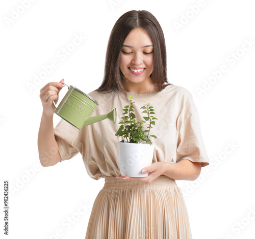 Young Asian woman watering ...