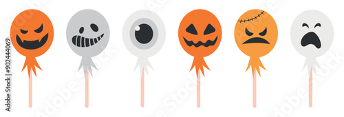 Sweet lollipops with scary pattern for Halloween, twisted hard candies on wooden stick
