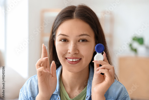 Young Asian woman with cont...