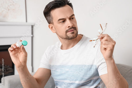 Thoughtful young man with c...