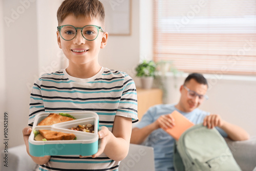 Little boy in eyeglasses wi...