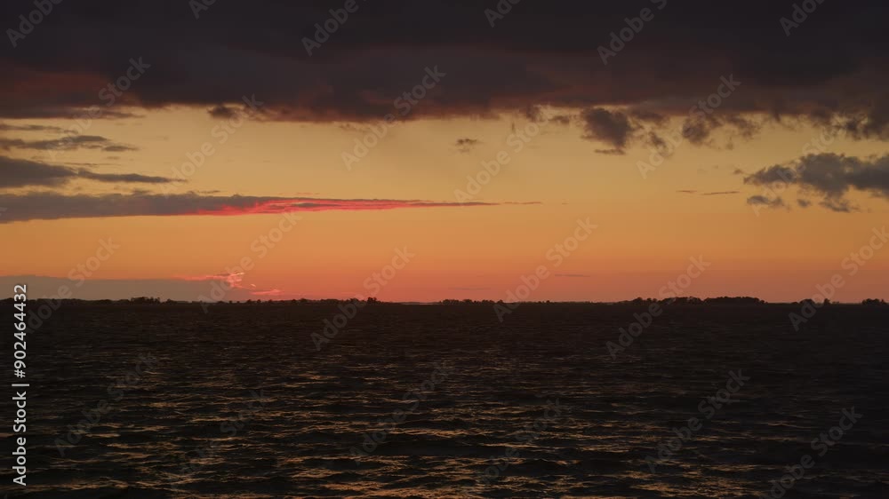 Sunset Over Dark River with Dramatic Clouds Sunset Over Dark River with Dramatic Clouds