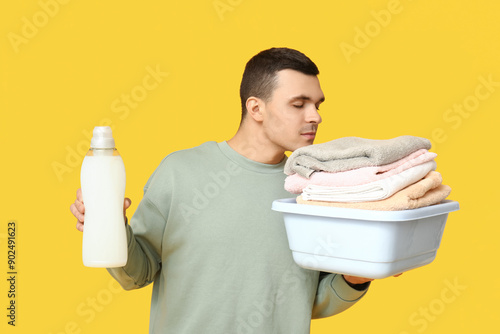 Young man with laundry bask...