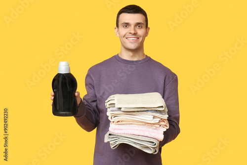 Young man with clean towels...