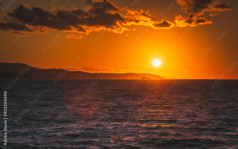 Obraz premium Summer holidays by the sea. Sunset at the beach