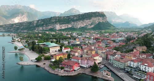 Aerial view Riva del Garda Italy. City streets at the foot of alpine mountains with houses, tourist landscapes. High quality 4k footage