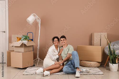 Young couple hugging in roo...