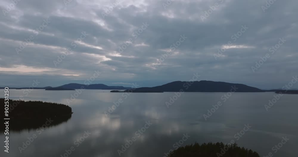 Wide pushing in shot of the Bellingham Bay in Washington State during a cloudy sunset. Wide pushing in shot of the Bellingham Bay in Washington State during a cloudy sunset.