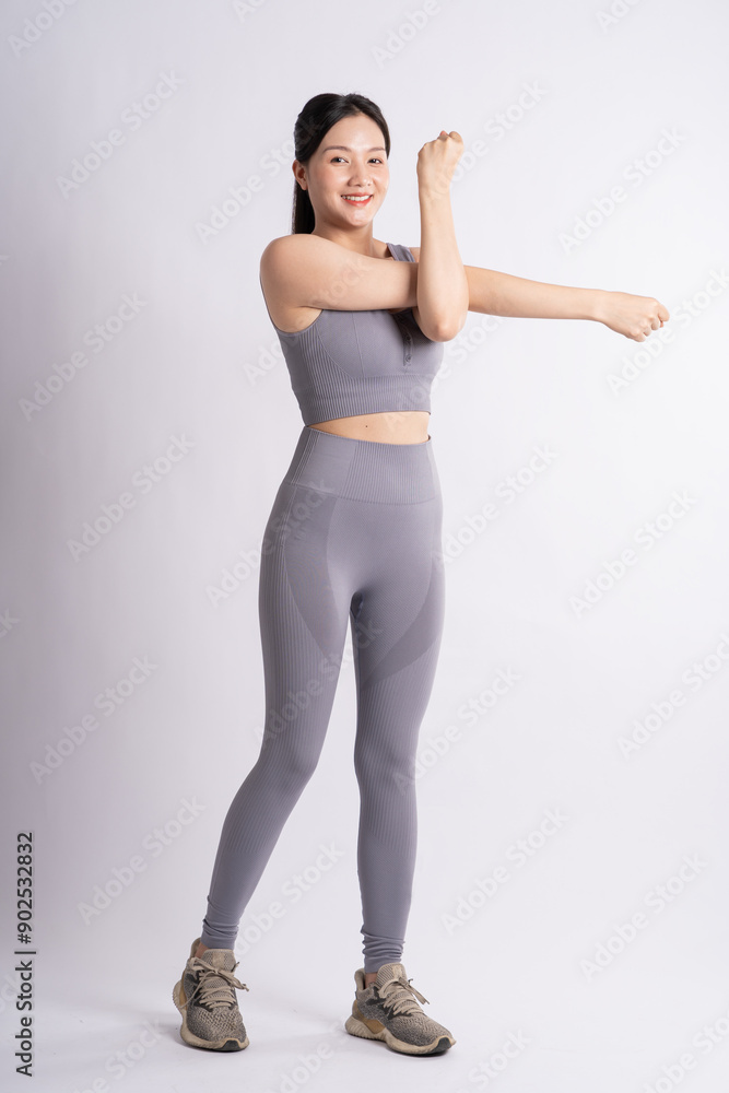 Portrait of Asian woman wearing sportswear, posing on white background. Portrait of Asian woman wearing sportswear, posing on white background.