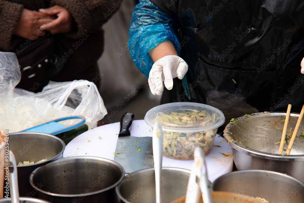 Fototapeta premium Making traditional summer food Liangpi