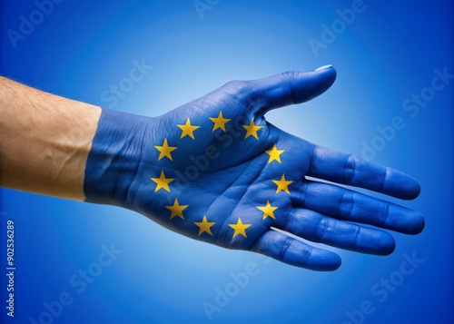 Colorful EU flag sleeve covers a hand extending for a handshake, symbolizing unity and cooperation on a bright blue background, celebrating European solidarity. photo